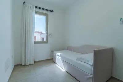 Letto o letti in una camera di Le Conchiglie Apartments with Pool by Wonderful Italy