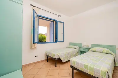 Letto o letti in una camera di ISA-Residence with swimming-pool in Cala Girgolu, apartments with private outdoor area
