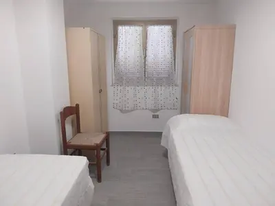 Letto o letti in una camera di Fpo-Fio42tp Casa su due Piani, 6 Pax A Ottiolu