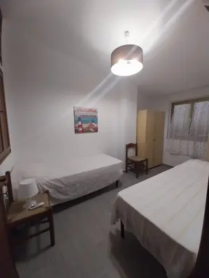 Letto o letti in una camera di Fpo-Fio42tp Casa su due Piani, 6 Pax A Ottiolu