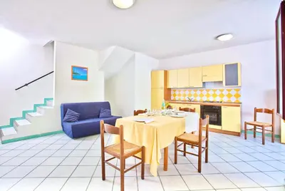 Cucina o angolo cottura di ISA-Residence with swimming-pool in Ottiolu just 250 mt from the sea, apartments with air conditioning and private outdoor area