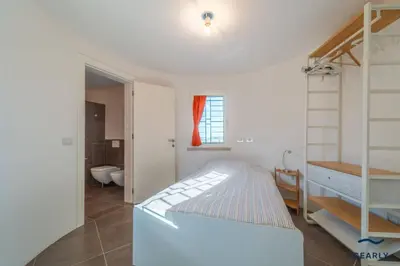 Letto o letti in una camera di Villa Nuraghe - By Searly