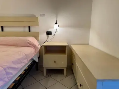 Letto o letti in una camera di Casa Isuledda 48