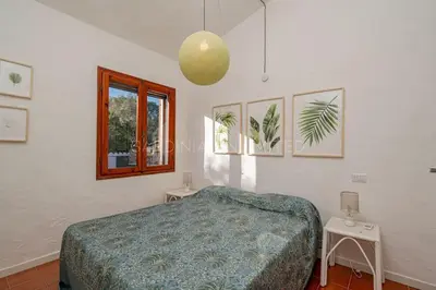 Letto o letti in una camera di Villa Il Richiamo di Gallura
