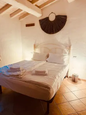Letto o letti in una camera di Isola Sarda Appart COSY