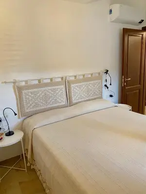 Letto o letti in una camera di Villa Cice, con giardino