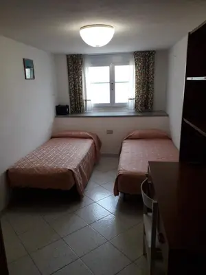 Letto o letti in una camera di Casa via Sardegna