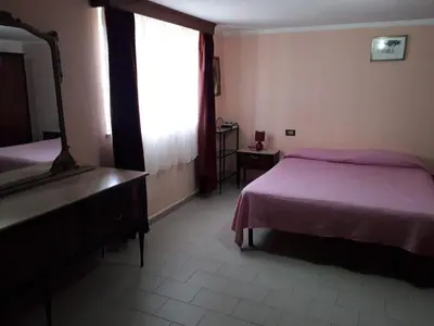 Letto o letti in una camera di Casa via Sardegna