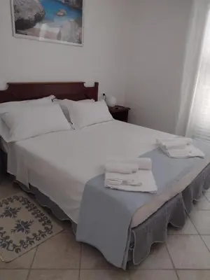 Letto o letti in una camera di Gardenia House