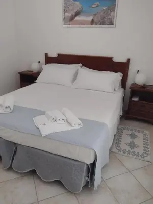 Letto o letti in una camera di Gardenia House