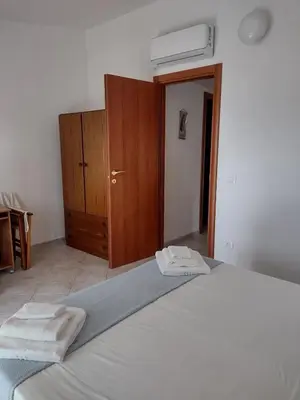 Letto o letti in una camera di Gardenia House