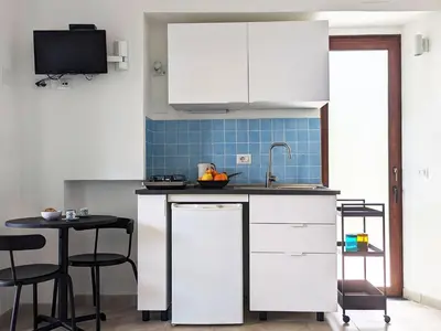 Cucina o angolo cottura di Ferienzimmer Ginepro am Meer