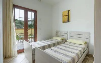 Letto o letti in una camera di Angel Village