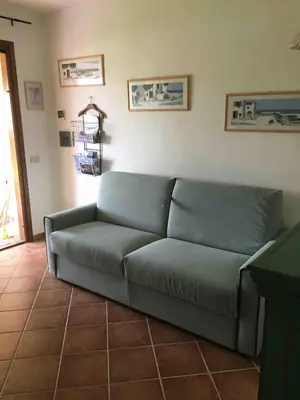 Area soggiorno di Dolcevita, cozy apartment with patio and garden