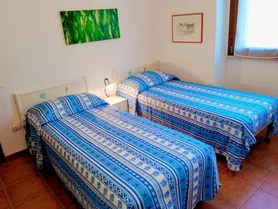 Letto o letti in una camera di Casa Max & Silvia