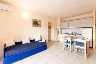 Area soggiorno di Golfo Aranci Apartments With Ac