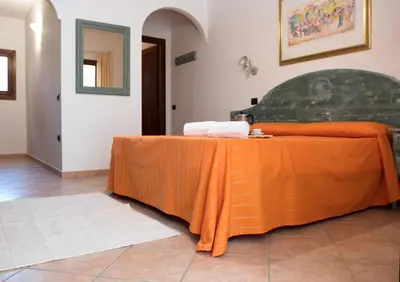 Letto o letti in una camera di Violet Residence In Orosei