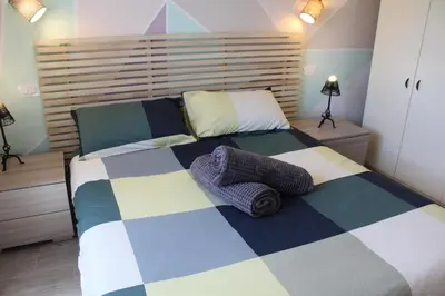 Letto o letti in una camera di casetta Ludo&Fili