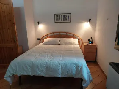Letto o letti in una camera di Orthilippa Giardino