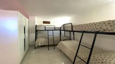 Letto o letti in una camera di La Brezza Apartment 8 posti letto San Teodoro Centro