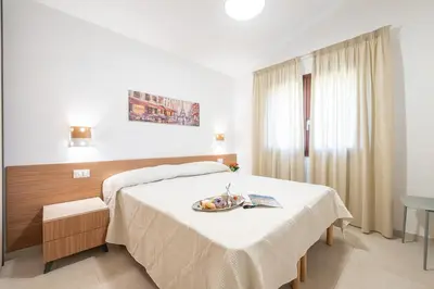 Letto o letti in una camera di AffittaSardegna- Villetta Meraviglia