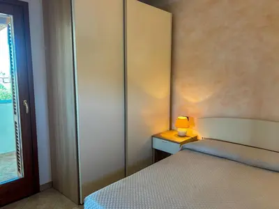 Letto o letti in una camera di Casa Marika