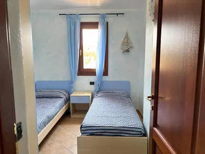 Letto o letti in una camera di Casa Marika