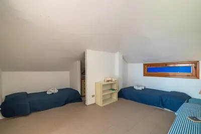 Letto o letti in una camera di Vista Mare 1