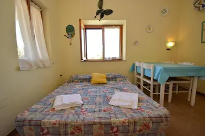 Letto o letti in una camera di Casa Nadia