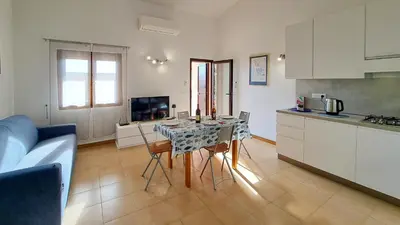 Cucina o angolo cottura di DaDa House Trilocale La Suaredda di Supra San Teodoro