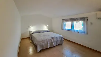Letto o letti in una camera di DaDa House Trilocale La Suaredda di Supra San Teodoro