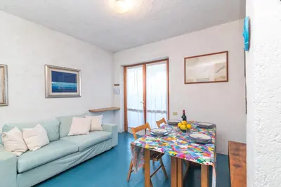 Area soggiorno di Piazzetta Trilo Porto 30m From The Beach - Happy Rentals