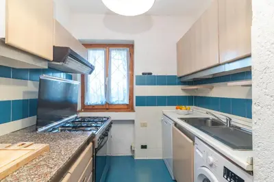 Cucina o angolo cottura di Piazzetta Trilo Porto 30m From The Beach - Happy Rentals