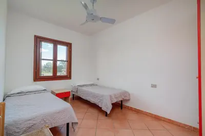Letto o letti in una camera di Residence Le Canne1