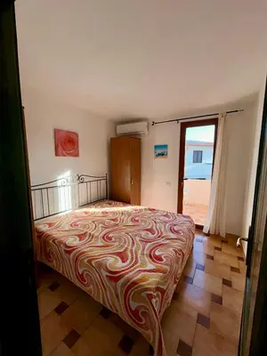 Letto o letti in una camera di Grazioso trilocale a Porto Ottiolu