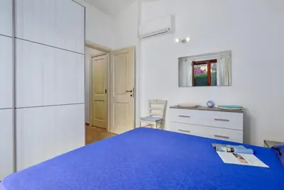 Letto o letti in una camera di Appartamento pittulongu