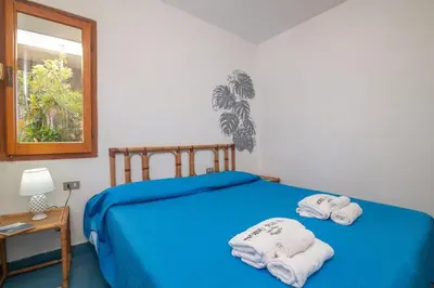 Letto o letti in una camera di Vista Isola 1