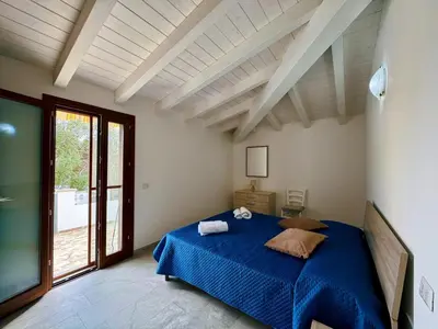 Letto o letti in una camera di CASA SAS ENAS trilocale indipendente -Ammentos Posada -