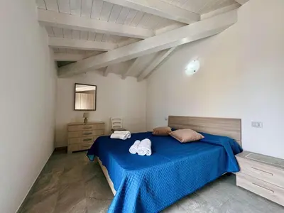 Letto o letti in una camera di CASA SAS ENAS trilocale indipendente -Ammentos Posada -