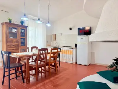Cucina o angolo cottura di Le Residenze dei Mandorli - Appartamenti immersi nel verde della macchia mediterranea a Orosei