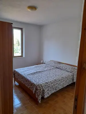 Letto o letti in una camera di Casa relax Berchida