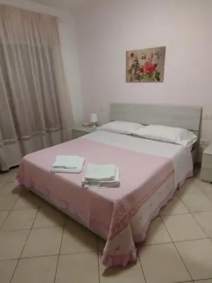 Letto o letti in una camera di La Casa di Rossella nel cuore della città , Downtown spacious apartment