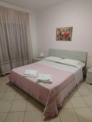 Letto o letti in una camera di La Casa di Rossella nel cuore della città , Downtown spacious apartment