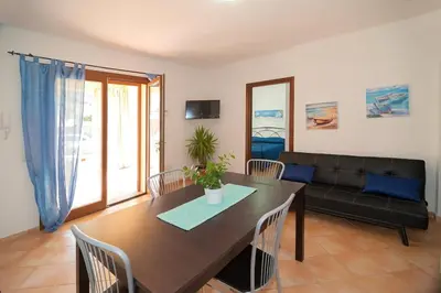 TV o dispositivi per l'intrattenimento presso Appartamento vicino alla spiaggia -G-