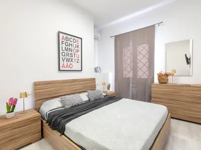 Letto o letti in una camera di Apartment Domus Flavia by Interhome