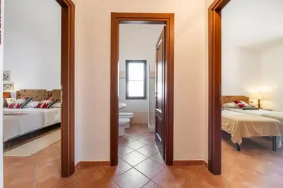 Letto o letti in una camera di Lovely cottage with garden near Orosei