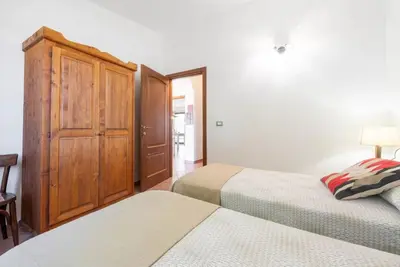 Letto o letti in una camera di Lovely cottage with garden near Orosei