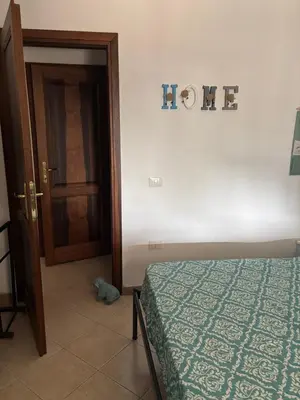 Letto o letti in una camera di Casa Azzurra