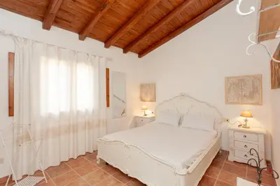 Letto o letti in una camera di Villetta Costa Caddu