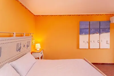 Letto o letti in una camera di Villetta Costa Caddu